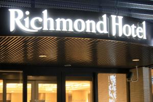 a sign for a rutherford hotel on the side of a building at Richmond Hotel Higashi Osaka in Osaka