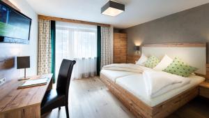 Voodi või voodid majutusasutuse Hotel Hubertushof toas