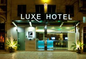 a hotel with a sign that reads live hotel at TURIM Luxe Hotel in Lisbon