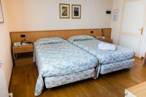 Postel nebo postele na pokoji v ubytování Locanda Solagna