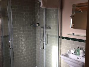 a bathroom with a shower and a sink at The Blackboys Inn in Framfield +36 photos