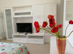 A television and/or entertainment centre at Le Villette - Taormina