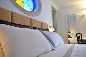 Biccari6 Terrace Apartment tesisinde bir odada yatak veya yataklar