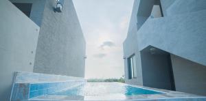 a swimming pool in the middle of a building at Boreum Pension in Seogwipo