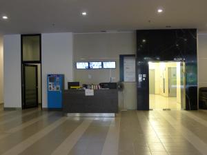 an office lobby with a reception desk in a building at KiddyPalace@Meridin in Nusajaya +28 photos