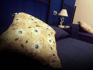 A bed or beds in a room at U dammusu ra cianta