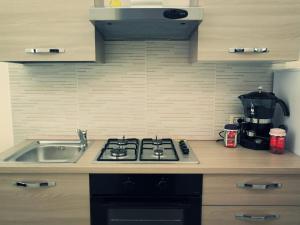 A kitchen or kitchenette at U dammusu ra cianta