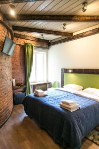  Кровать или кровати в номере Bronza Hotel 