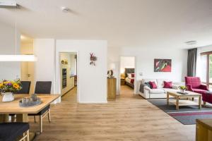 a living room with a couch and a table at Sonjas Himmel in Höchenschwand