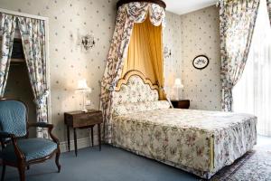 En eller flere senge i et værelse på Domaine de Brou