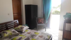 Postel nebo postele na pokoji v ubytování lakazadom974 - Chambres d'Hôtes