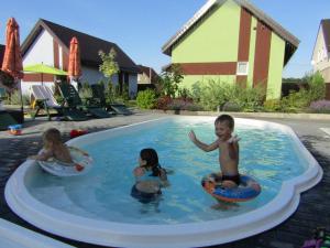 a group of children playing in a swimming pool at Perlyna Dzvinkova in Dzvinkove