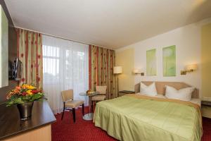 Voodi või voodid majutusasutuse Johannesbad Hotel Phönix toas