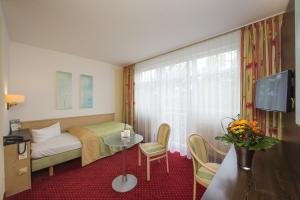 Voodi või voodid majutusasutuse Johannesbad Hotel Phönix toas
