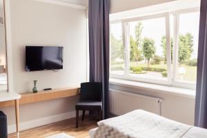 TV i/ili multimedijalni sistem u objektu Rannahotell