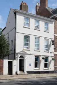a white building on a city street at Georgian House & Mews in York