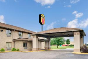 a gas station with a traffic light in front of it at Super 8 by Wyndham Kokomo in Kokomo