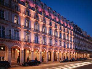a large building with cars parked in front of it at Le Meurice – Dorchester Collection in Paris