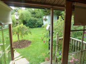 a view of a garden from the window of a house at Hillside Self Catering in Salisbury