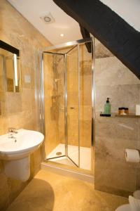 a bathroom with a shower and a sink at Georgian House & Mews in York