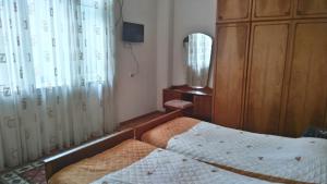 Cama ou camas em um quarto em Nana's Apartment in Batumi