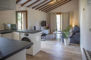 A television and/or entertainment centre at Excepcional Apartamento El Olivo