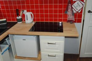 Kuchyň nebo kuchyňský kout v ubytování Grey House