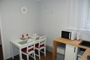 Kuchyň nebo kuchyňský kout v ubytování Grey House