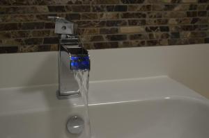 a kitchen sink with a water faucet at Fewo Calico in Eging