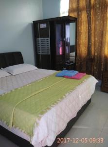 En eller flere senger på et rom på Penginapan MyCJ - Roomstay