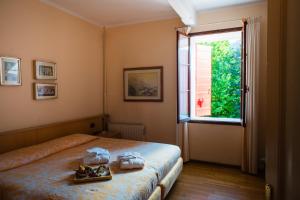 Postel nebo postele na pokoji v ubytování Locanda Solagna