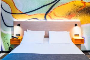 Katil atau katil-katil dalam bilik di ibis Styles Clamart Gare Grand Paris