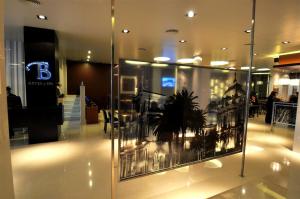 a display case in a building with a plant in it at Hotel Bicentenario Suites & Spa in San Miguel de Tucumán