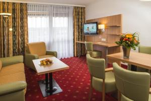 TV a/nebo společenská místnost v ubytování Johannesbad Thermalhotel Ludwig Thoma