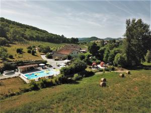 an aerial view of a farm with a pool at La Bordette in Valeilles