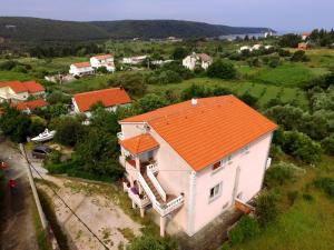 an overhead view of a house with an orange roof at Apartmani Margeta in Rab +10 photos