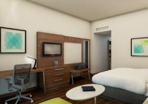 a hotel room with a bed and a desk with a computer at Holiday Inn Express Villahermosa by IHG in Villahermosa