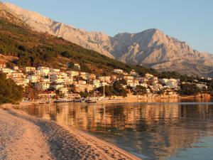 a small town on the shore of a body of water at Guest House Mijo Sokol in Brela