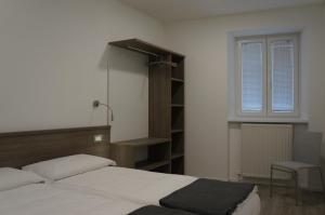 Posteľ alebo postele v izbe v ubytovaní Casa vacanze da Alcide