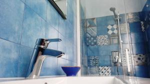 a bathroom with a sink and a faucet at Gloria House in Levanto