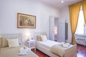 Łóżko lub łóżka w pokoju w obiekcie Leonardo Suite Navona