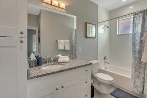 a white bathroom with a sink and a toilet at New 3/2 Duplex Minutes From Heart of Tampa -Unit B in Tampa +19 photos