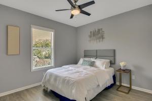 a bedroom with a bed and a ceiling fan at New 3/2 Duplex Minutes From Heart of Tampa -Unit B in Tampa