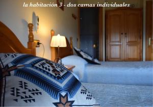 En eller flere senge i et værelse på Casa Dueso