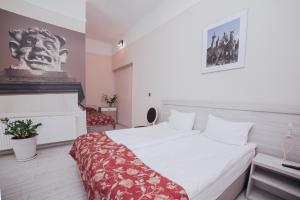 Posteľ alebo postele v izbe v ubytovaní Apartamenty Bonerowska 5