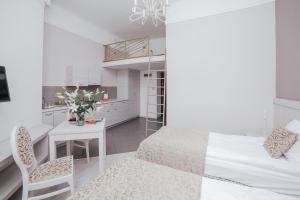 Posteľ alebo postele v izbe v ubytovaní Apartamenty Bonerowska 5