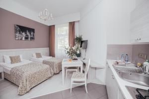 Posteľ alebo postele v izbe v ubytovaní Apartamenty Bonerowska 5