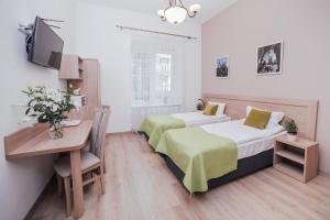 Posteľ alebo postele v izbe v ubytovaní Apartamenty Bonerowska 5