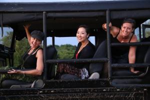 a group of people sitting in the back of a train at Kottamba Yala Stay & Safari in Tissamaharama
