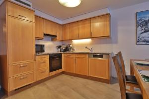 Kuchyň nebo kuchyňský kout v ubytování Ferienwohnung Steinmattstrasse